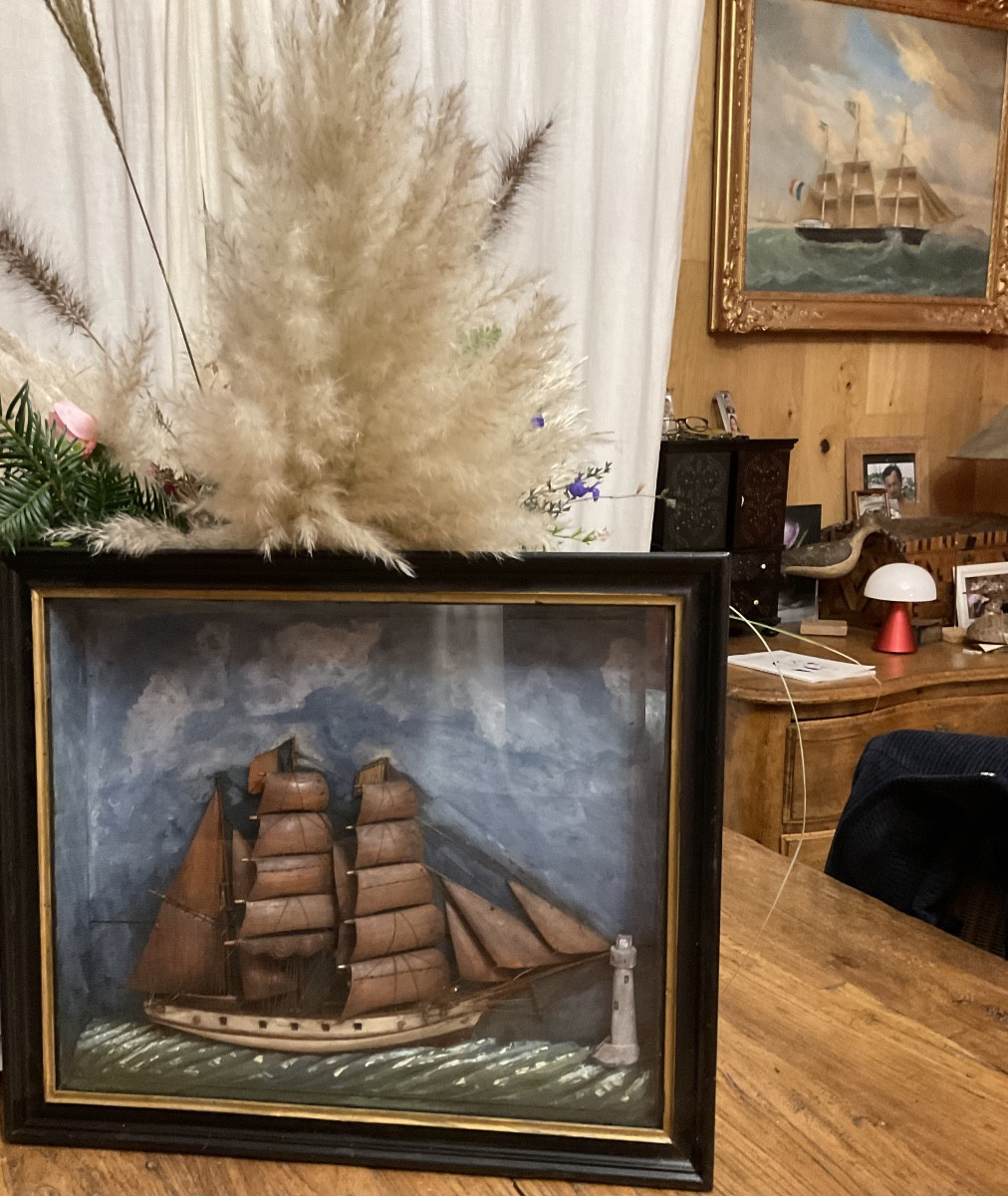 Diorama Of A Wooden Sailboat With A Lighthouse -photo-4