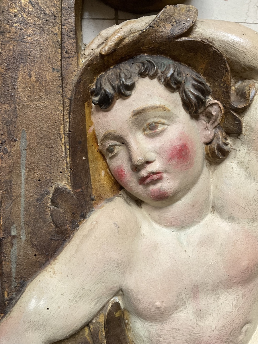 Paire de putti  en bas relief chêne XVIIIe