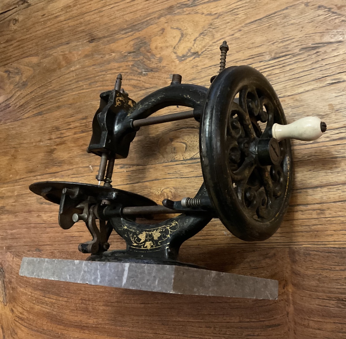 Hand-operated Sewing Machine Made Of Enameled Cast Iron Mounted On A Marble Base-photo-1