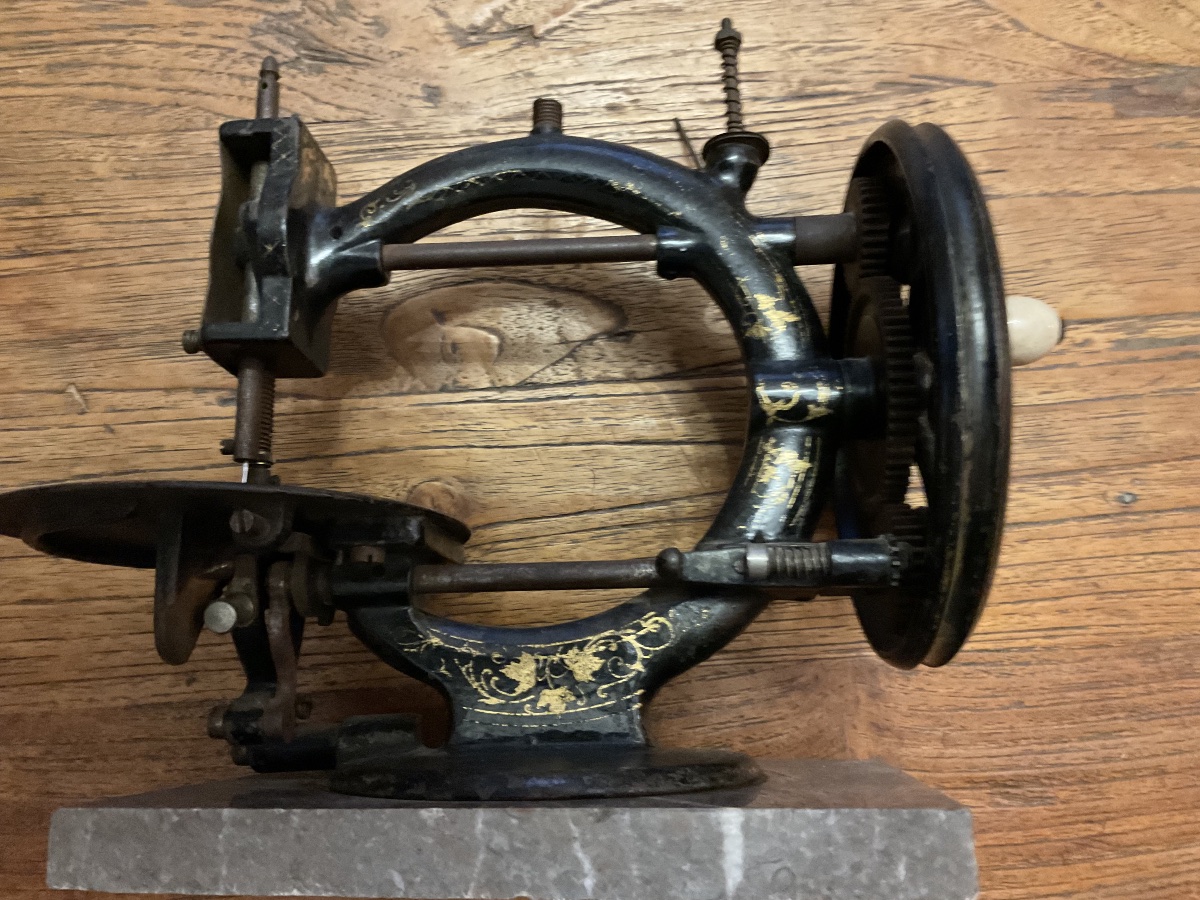 Hand-operated Sewing Machine Made Of Enameled Cast Iron Mounted On A Marble Base-photo-2