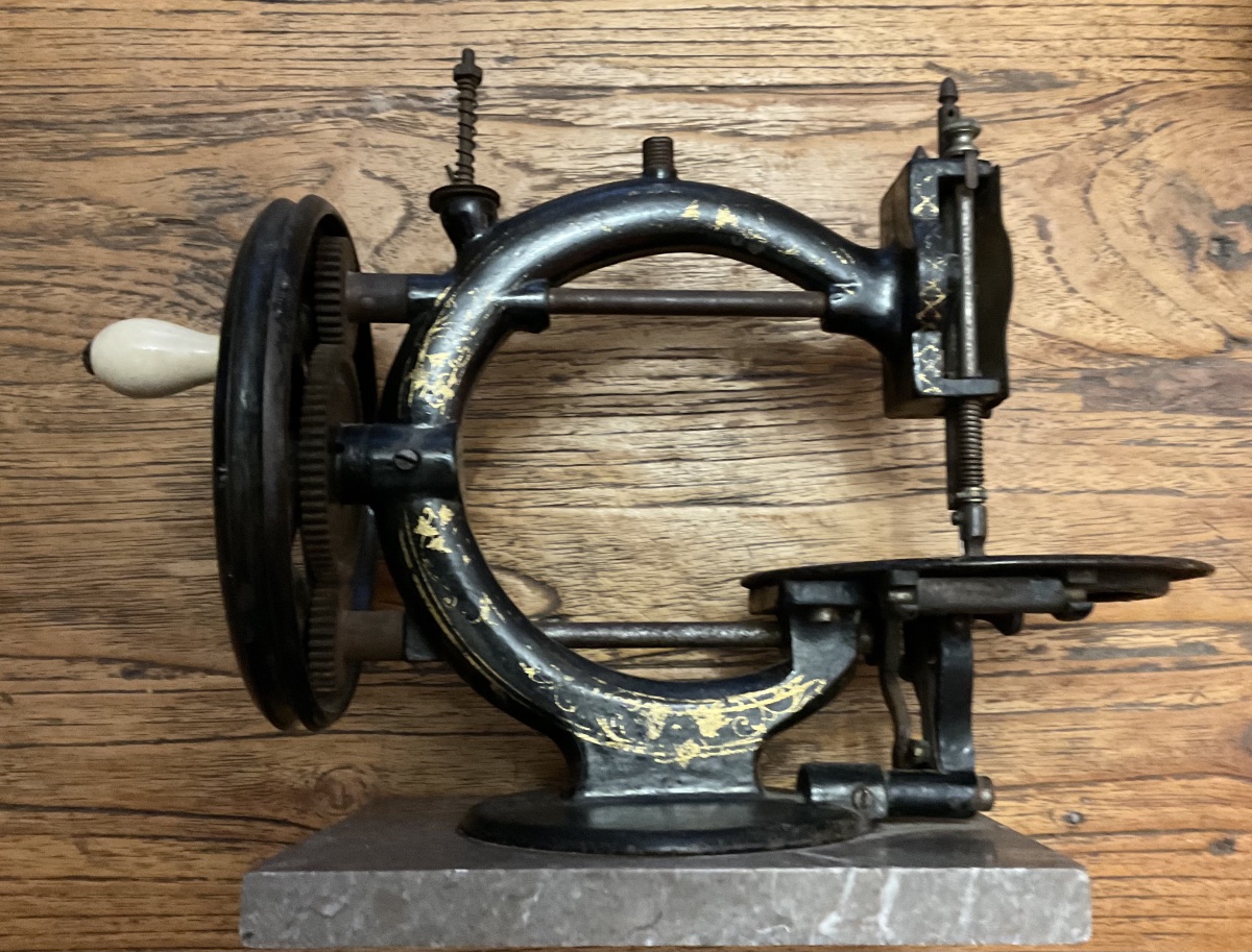Hand-operated Sewing Machine Made Of Enameled Cast Iron Mounted On A Marble Base