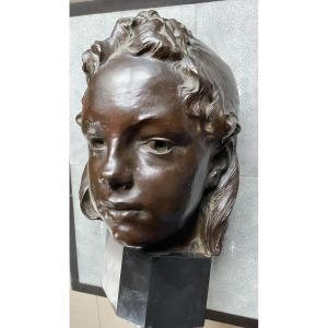 Tête de jeune fille bronze 