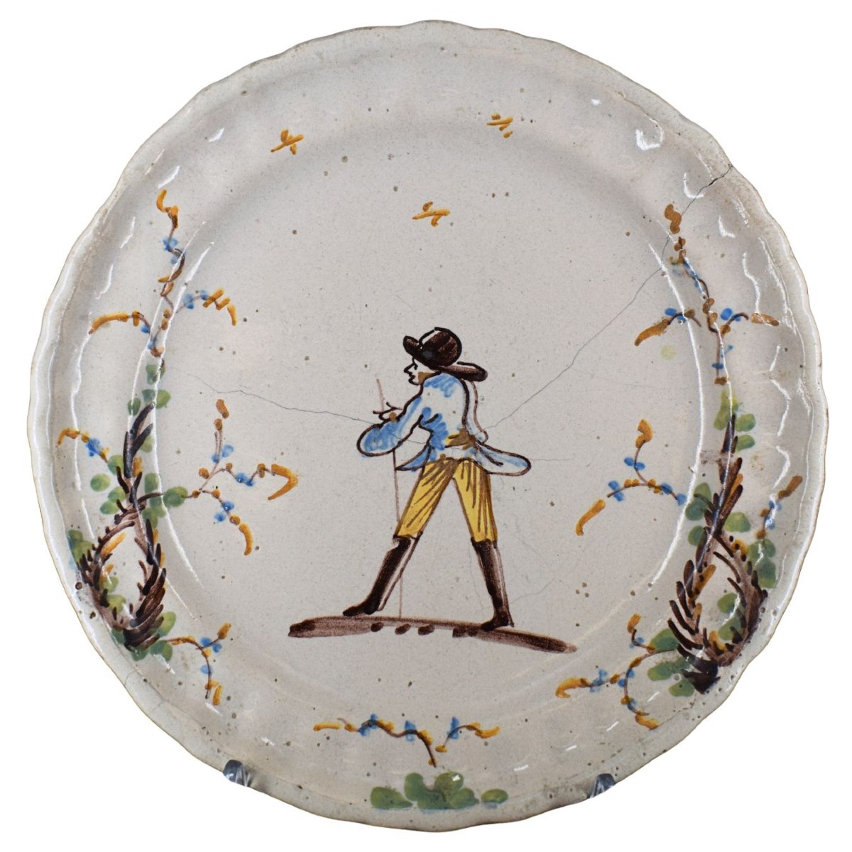 Assiette en majolique représentant un voyageur et des grappes de raisin, Borghetto Lodigiano, X