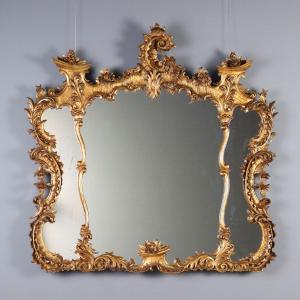 Miroir en bois sculpté et doré Italie, début du XXe siècle