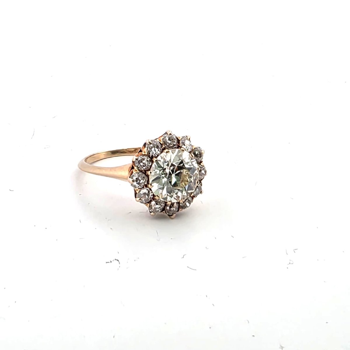 18kt Rose Gold Ring With A Center Diamond And Diamonds Set Around It-photo-2