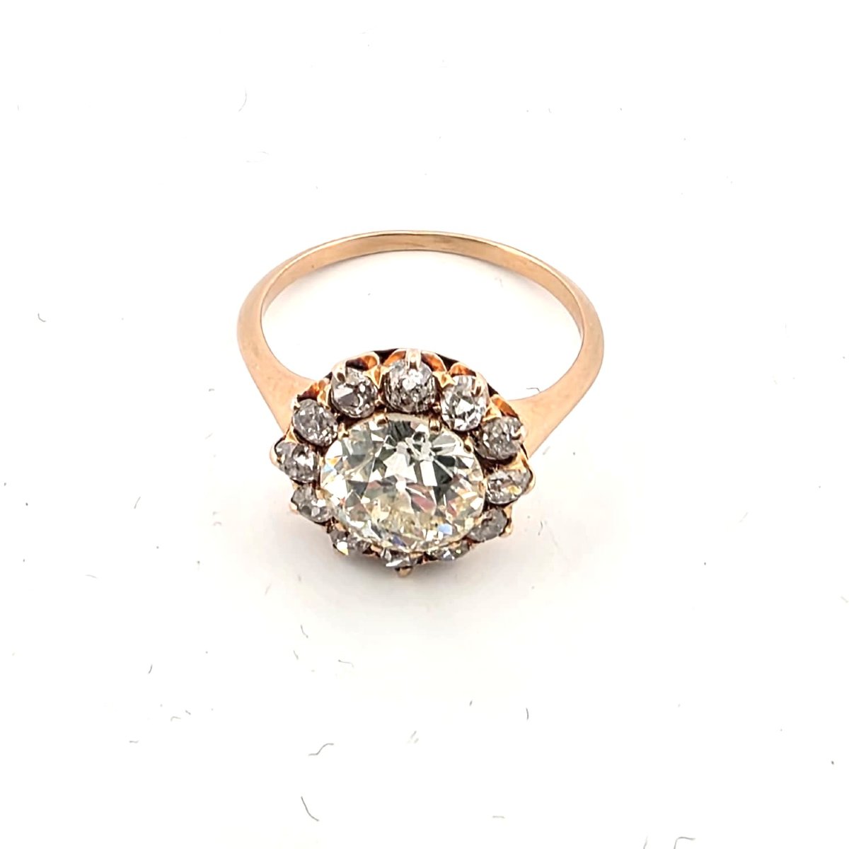 18kt Rose Gold Ring With A Center Diamond And Diamonds Set Around It-photo-1