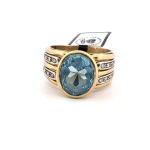 Bague années 90' en or jaune 18 kt massif avec grande topaze bleue et diamants sur les côtés de
