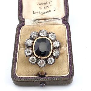 Bague en or jaune faible et argent avec diamants et saphir