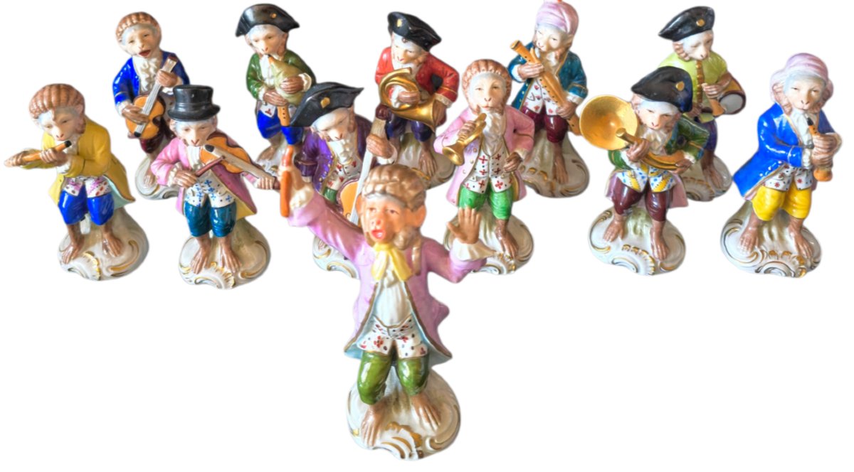 A Superb Collection Of 12 Polychrome Porcelain Figurines Depicting The Famous S Orchestra