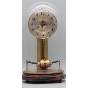 BULLE CLOCK Pendule squelette magnétique en laiton à mouvement perpétuel sous globe