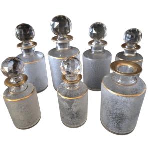 Baccarat Crystal Toilet Set With Engraving And Gold Plating; 7 Numbered Perfume Bottles