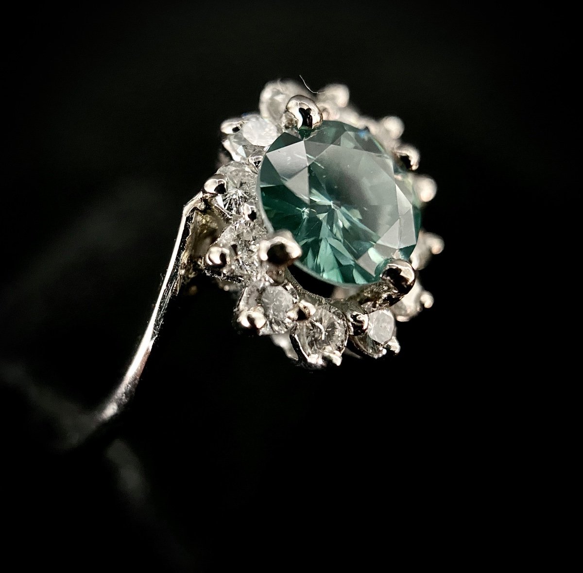 White Gold Ring Set With A 1.03 Carat Green Diamond Surrounded By 0.50 Carat Of Brilliant