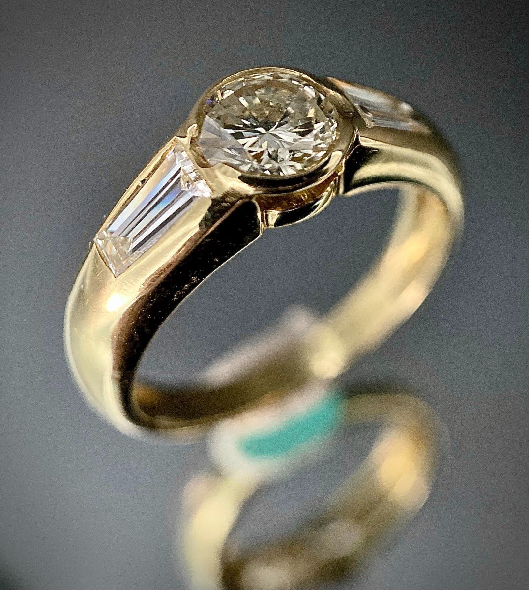 18k Yellow Gold Ring With 1 Diamond Of 0.55 Carat And 2 Baguettes 0.50 Carat