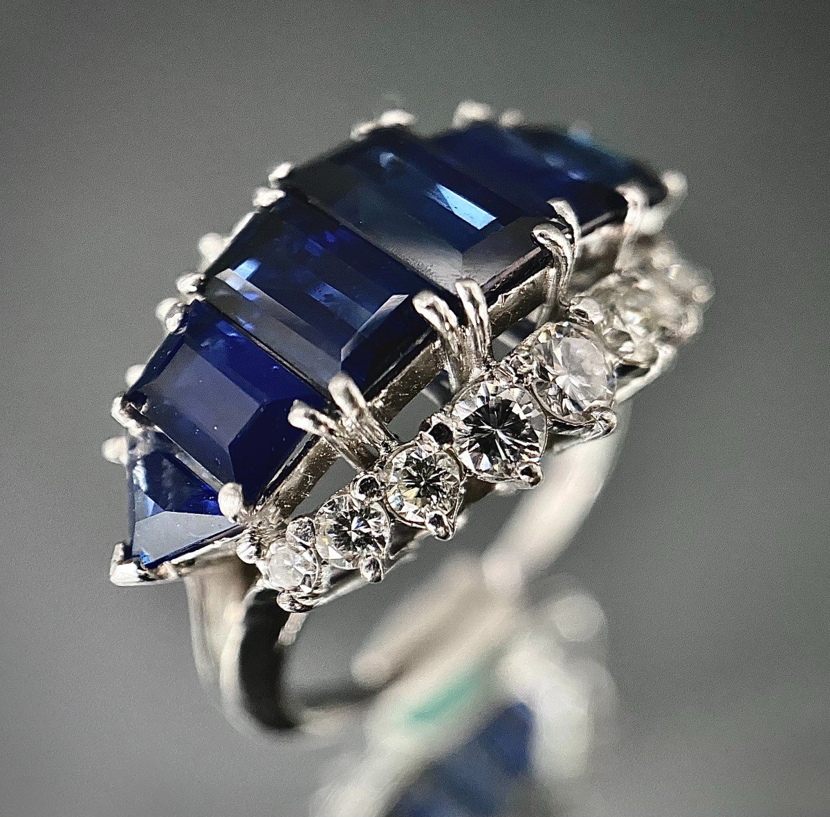 Platinum Ring Adorned With 7 Sapphires Totaling 5 Carats And 1.50 Carats Of Diamonds