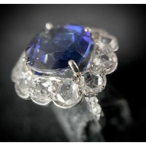 Antique Platinum Ring Set With A Cushion Cut Sapphire Of 4.70 Carats