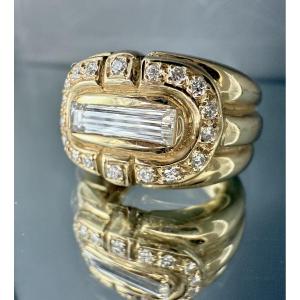Yellow Gold Ring Set With 1 Baguette-cut Diamond Of 1 Carat Surrounded By 18 Brilliants