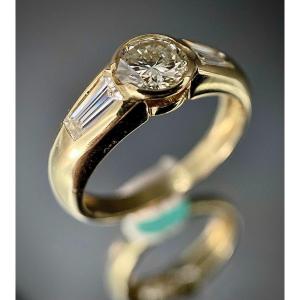 18k Yellow Gold Ring With 1 Diamond Of 0.55 Carat And 2 Baguettes 0.50 Carat