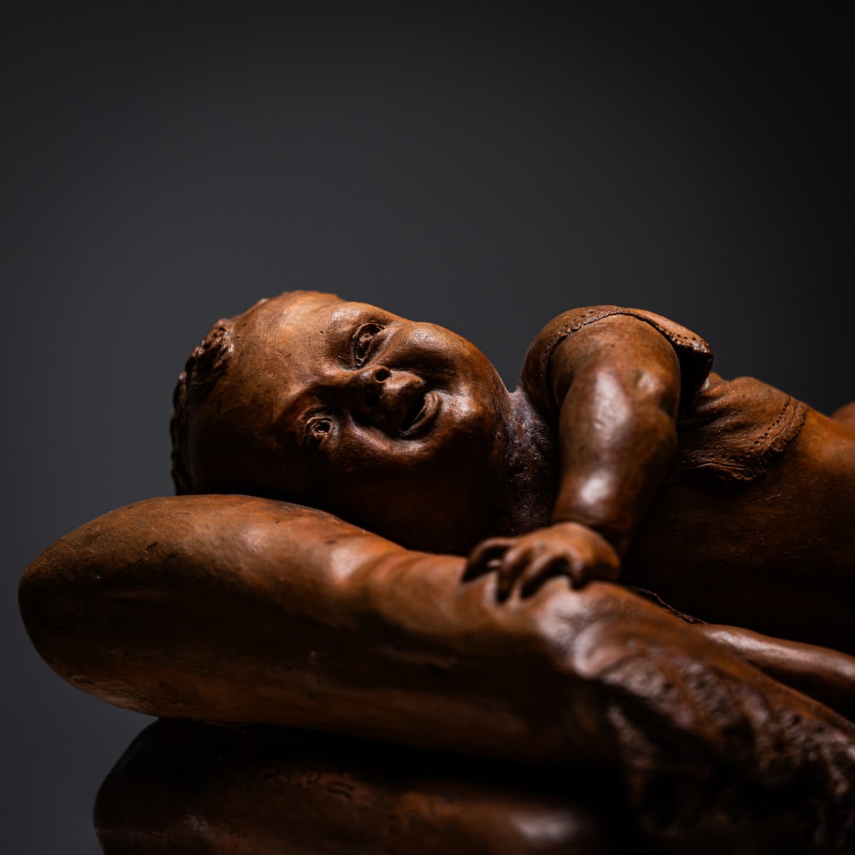 Terracotta Reclining Baby, Signed F. Sans, Probably Spain, Late 19th Century
