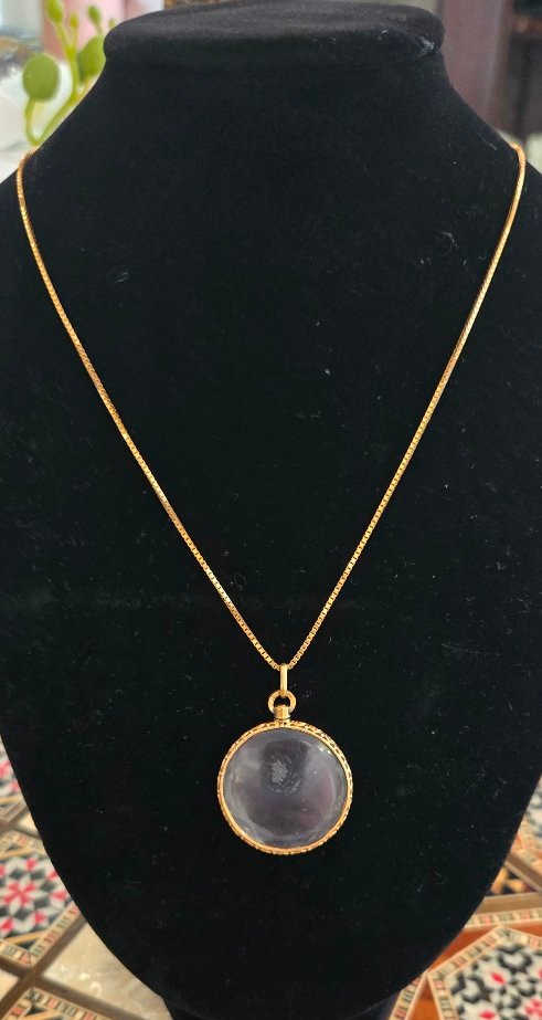 An Antique 18-karat Gold Photo Locket 