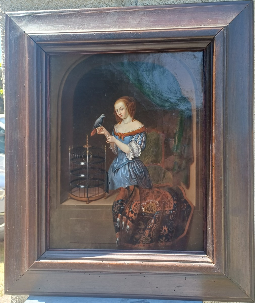 Hst Woman Feeding A Parrot Flemish School Of Aptres Jacob Ochtervelt