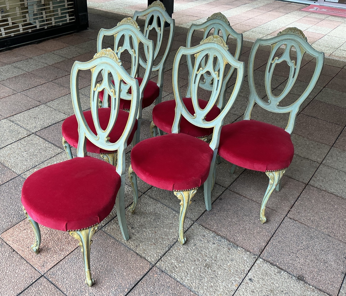 Six Chairs In Painted And Gilded Wood.