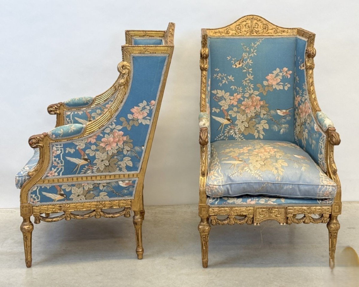 Pair Of Gilt Armchairs Decorated With Carved Tendrils And Garlands Of Acanthus.