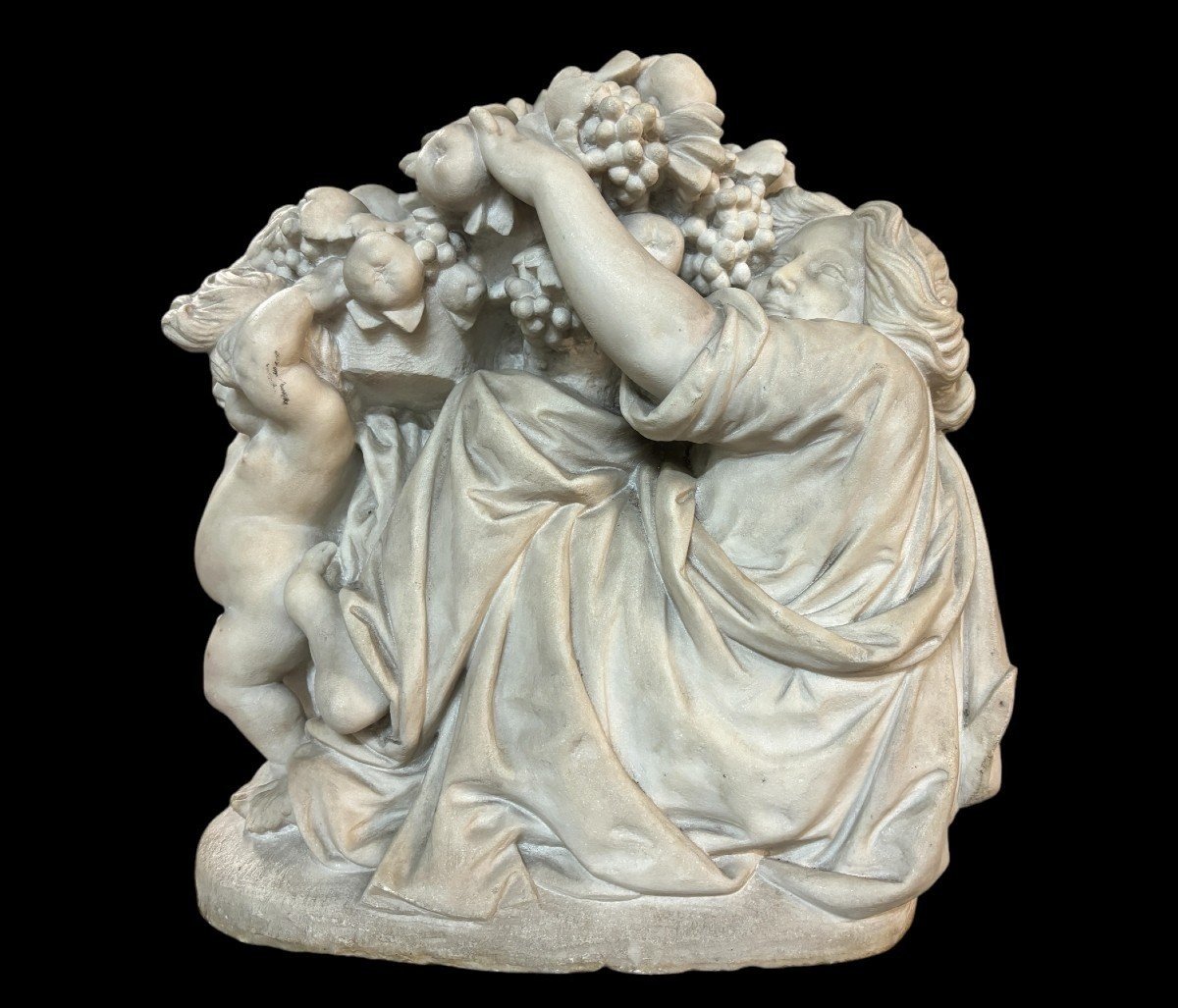 19th-century Carrara Marble Sculpture Entitled ‘woman And Putti Carrying Baskets Of Fruit’.