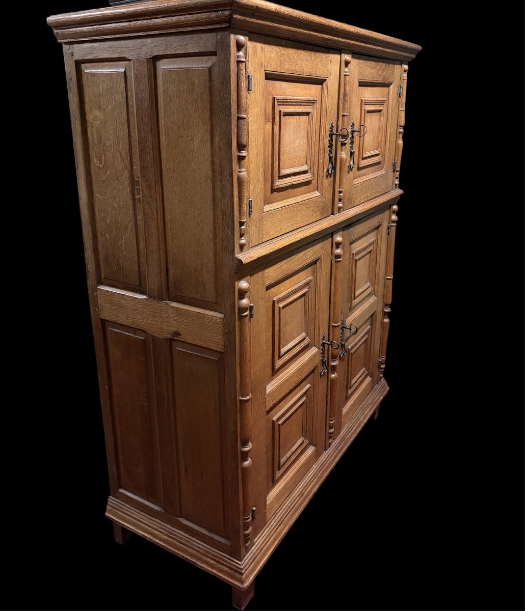 A Four-door Cabinet Made Of Bleached Oak 