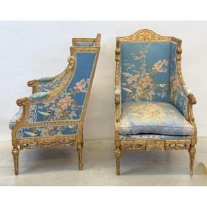 Pair Of Gilt Armchairs Decorated With Carved Tendrils And Garlands Of Acanthus.