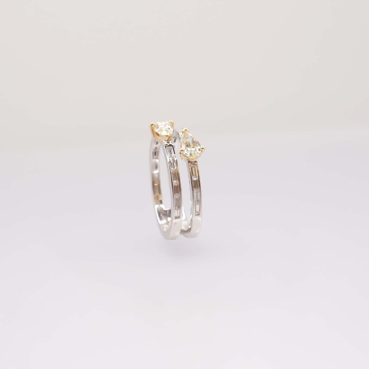 Ring Adorned With Pear-shaped Daffodil Diamonds And Baguette Diamonds