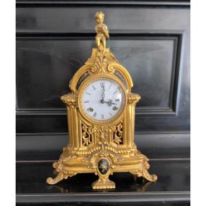 Horloge en bronze laqué or