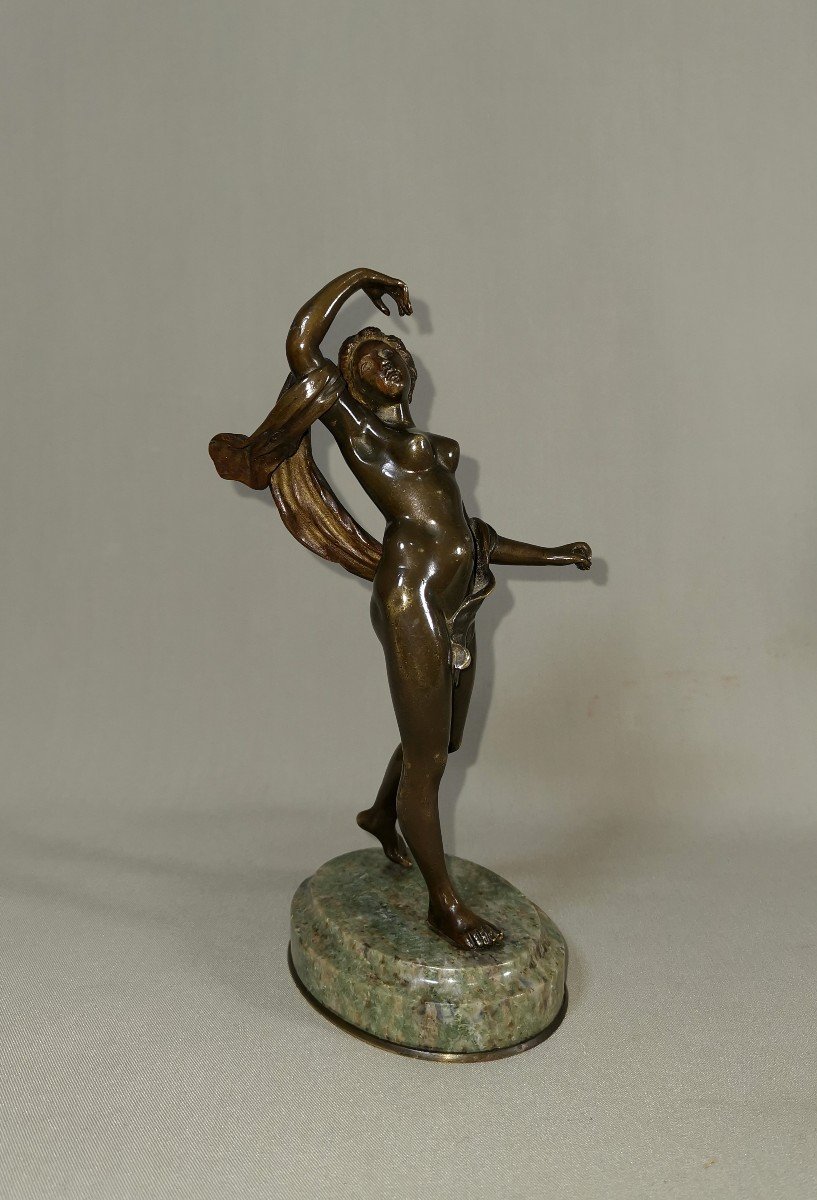 Ancient Bronze Sculpture Depicting A Young Nude Dancer Slightly Concealed With A Veil-photo-1