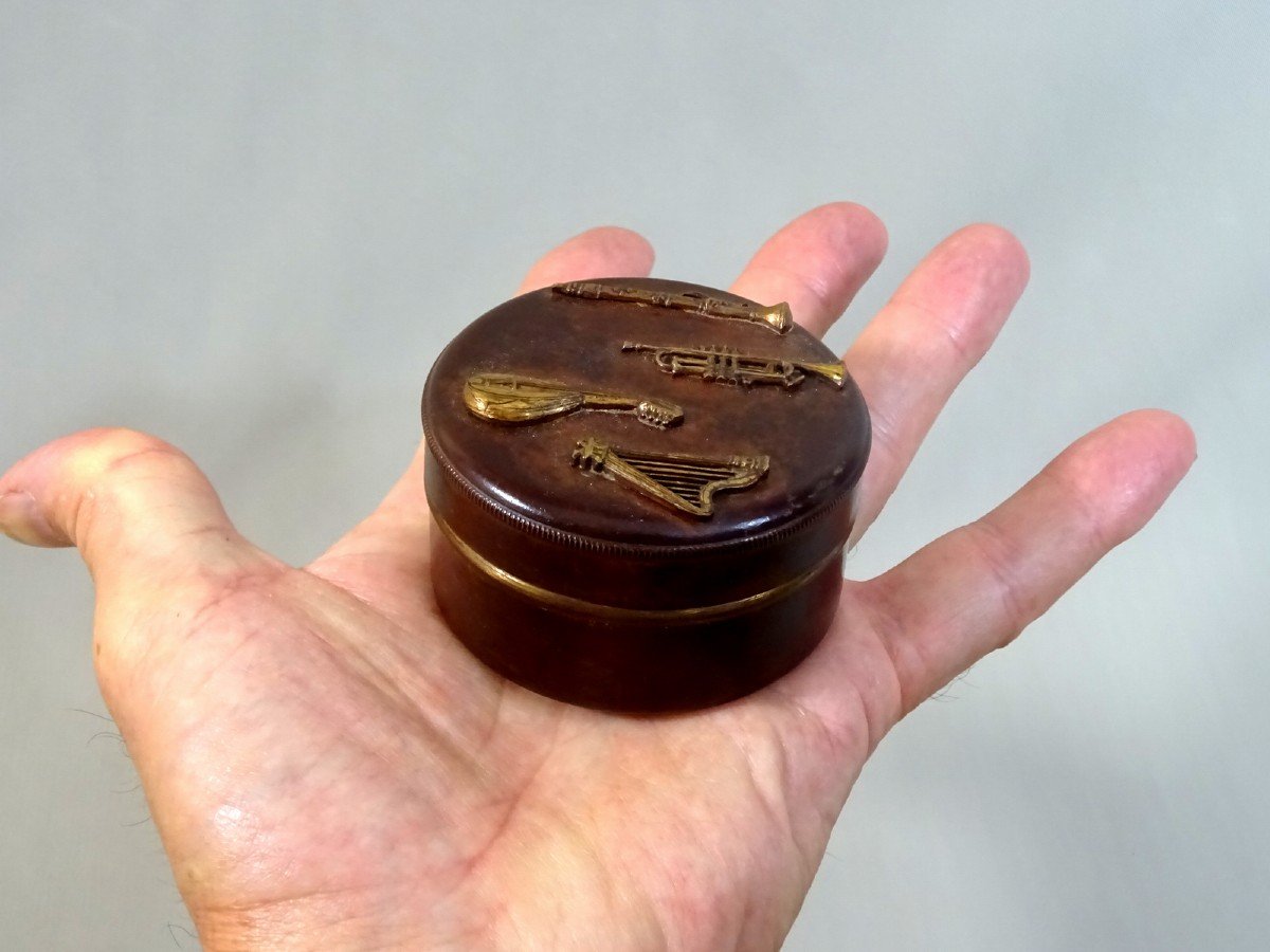 Old Circular Copper Dinanderie Rosin Box With Applied Musical Instrument Decoration-photo-2