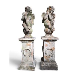 Paire de sculptures italiennes en terre cuite représentant des chérubins sur piédestaux (XIXe s
