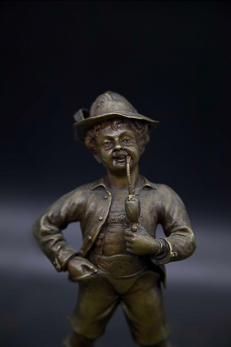 Small Chiseled Bronze Young Man Smoking A Pipe