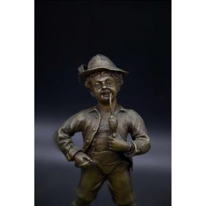 Small Chiseled Bronze Young Man Smoking A Pipe