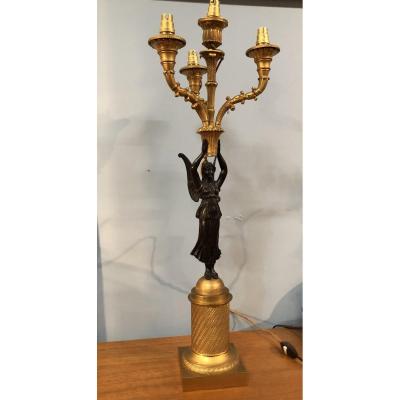 Candélabre en bronze dorés empire à la Victoire monté en Lampe .