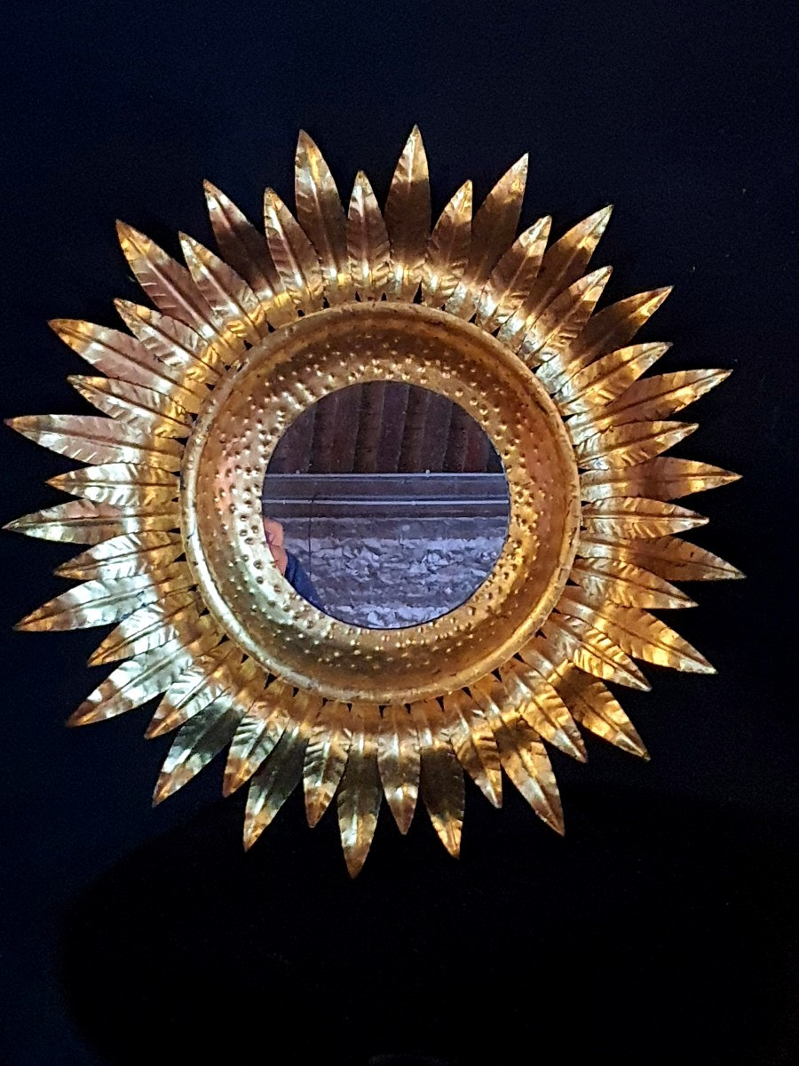 Miroir soleil métal doré. 