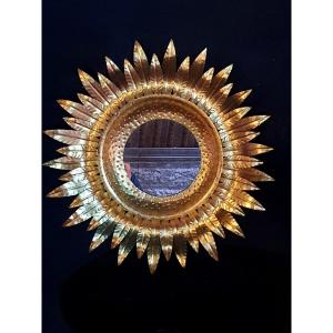 Miroir soleil métal doré. 