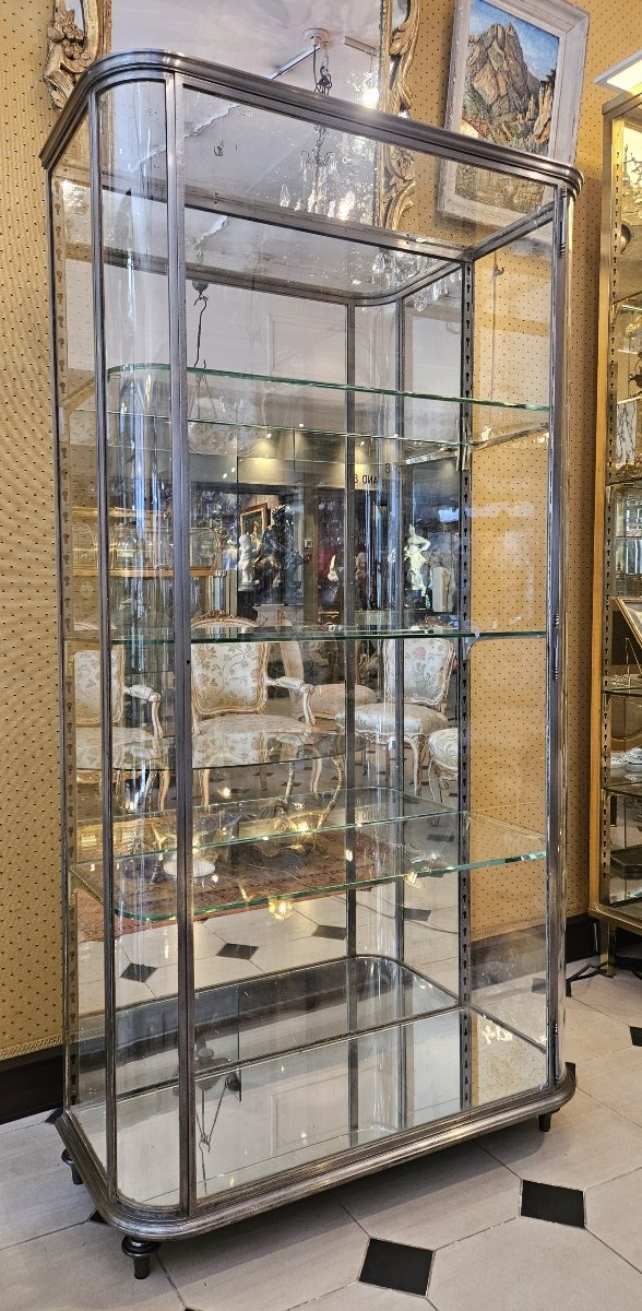 Early 20th-century Storefront Display Cabinet With Curved Sides Made Of Polished Steel.