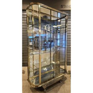 Vitrine d’exposition en laiton à cotés bombés- Début du XX siècle.