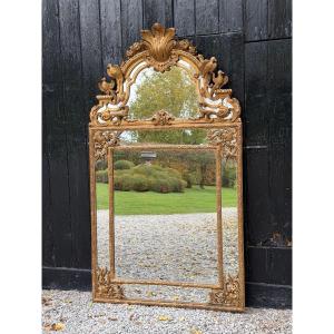 Miroir de style Régence en bois doré, XIXème siècle 