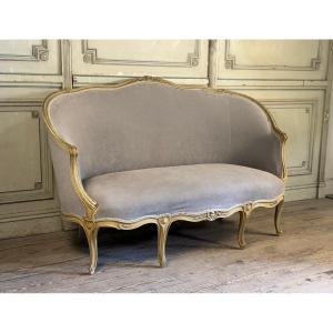 Banquette corbeille de style Louis XV en bois sculpté et peint, XIXème siècle