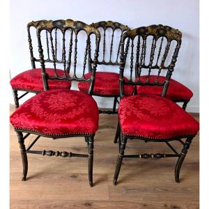 Série de cinq chaises Napoléon III, bois laqué noir et dorée