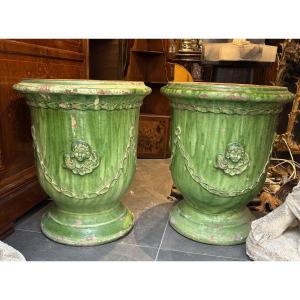 Pair Of Green Anduze Vases With Angel Heads And Garlands 