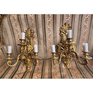 Paire d appliques en bronze doré fin XIXe de style LXIV à décor de masque et plumes d autruche 