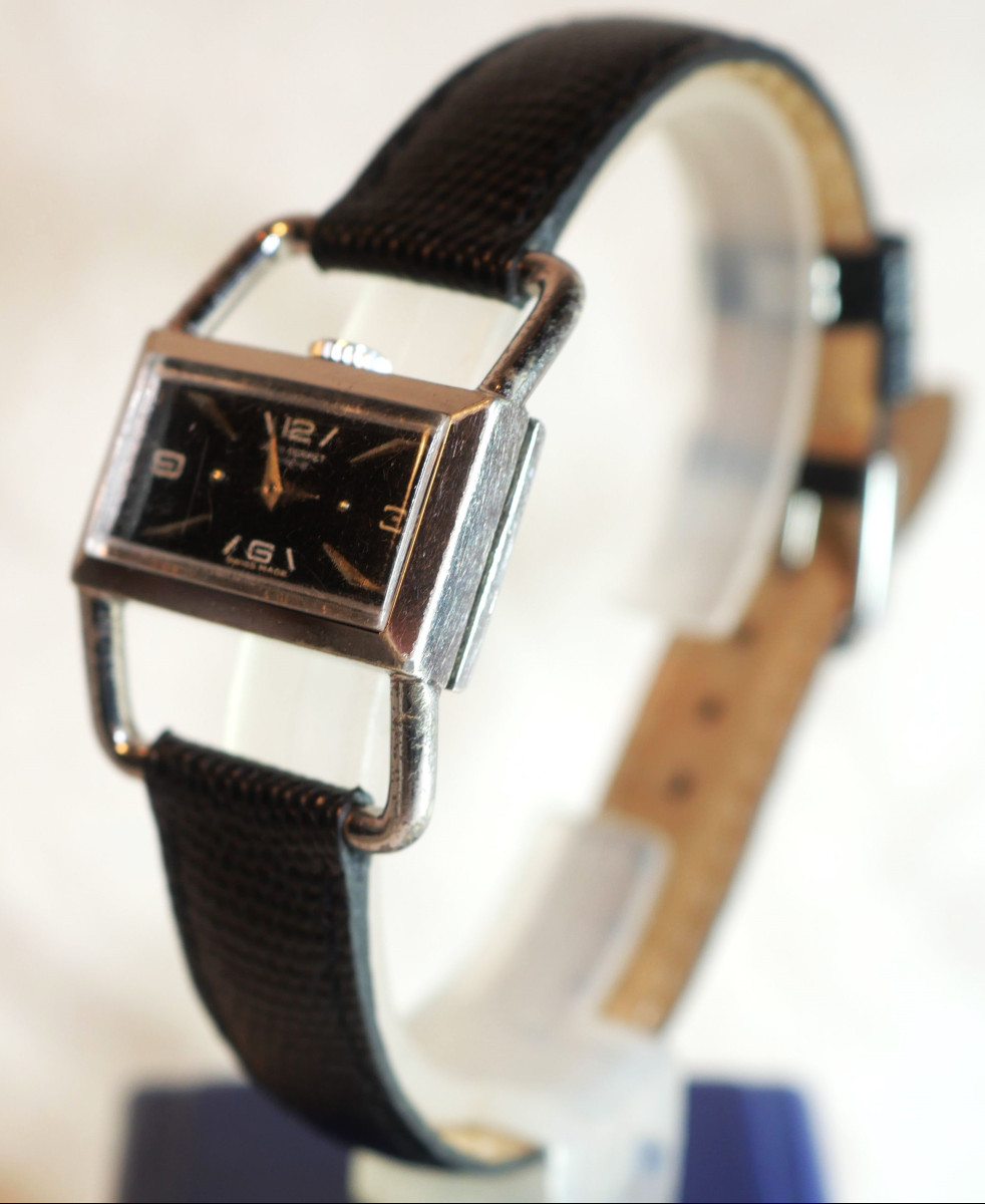 HERMES Jean Perret Genève Montre bracelet à double étriers cadran noir révisée JGL24FER001