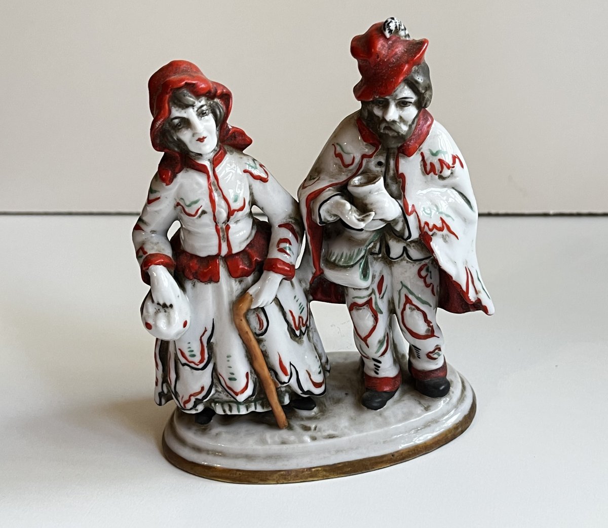 Porcelain Pair Of Beggars, Mid-20th Century.