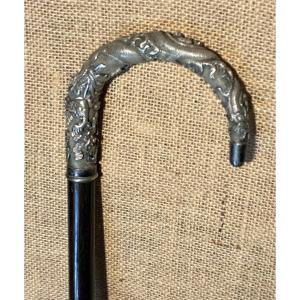 Rosewood Cane With A Chiseled Silver Pommel, 19th Century