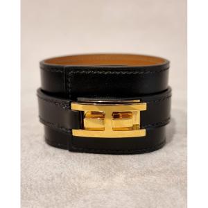 Hermès Bracelet Manchette modèle DRAG plaqué or et cuir noir